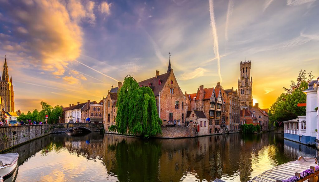 Historic market square in Bruges with the belfry tower